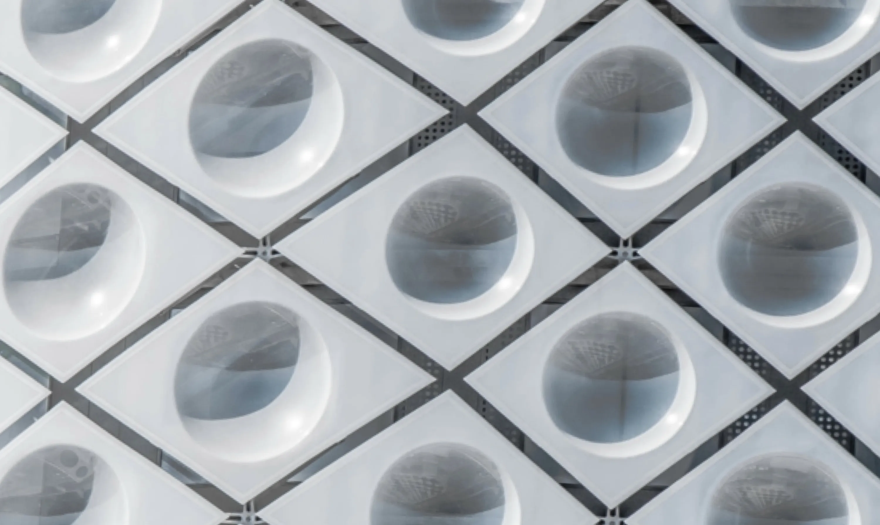 Circles, Diamonds, and Reflections in Facade of Parking Garage